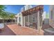 Relaxing screened-in patio featuring brick flooring and comfortable seating, ideal for outdoor enjoyment at 446 Burns Ct, Sarasota, FL 34236