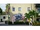 Unique street art featuring a camera mural on a building's facade, adding a creative touch to the urban environment at 446 Burns Ct, Sarasota, FL 34236