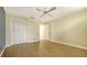 Bright bedroom with closet, and warm plank flooring at 4737 Meadowview Cir, Sarasota, FL 34233