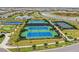 Overhead view of the tennis, basketball and pickleball courts along with a putting green in the community at 4820 Coastal Days Ln, Bradenton, FL 34211