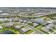 Expansive aerial shot highlighting a community's layout featuring interconnected waterways and well-planned residential areas at 4820 Coastal Days Ln, Bradenton, FL 34211