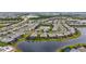 Comprehensive aerial shot displaying a community’s design, featuring waterfront homes and interconnected roadways at 4820 Coastal Days Ln, Bradenton, FL 34211