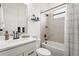 Bathroom with a modern vanity, a shower over tub combo, and neutral tile work at 4820 Coastal Days Ln, Bradenton, FL 34211