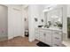 Bathroom boasts wood flooring, a spacious vanity, and a separate toilet room at 4820 Coastal Days Ln, Bradenton, FL 34211