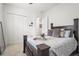 Cozy bedroom featuring a large bed, walk-in closet, and serene decor at 4820 Coastal Days Ln, Bradenton, FL 34211