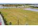 Large open community field with soccer goals, green grass and walking paths at 4820 Coastal Days Ln, Bradenton, FL 34211