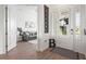Bright foyer features tiled floors, white trim, and a glimpse into the living room with neutral decor at 4820 Coastal Days Ln, Bradenton, FL 34211