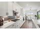 Well-appointed kitchen with stainless steel appliances, gas range, quartz countertops, and sleek cabinetry at 4820 Coastal Days Ln, Bradenton, FL 34211
