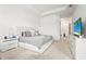Spacious main bedroom featuring neutral tones, a tray ceiling, and an ensuite bathroom at 4820 Coastal Days Ln, Bradenton, FL 34211