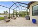 Outdoor patio with chaise lounges overlooking lake, a perfect spot for relaxation and enjoying tropical breezes at 4820 Coastal Days Ln, Bradenton, FL 34211