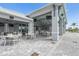 Outdoor seating area with tables, chairs, and lighting for residents at 4820 Coastal Days Ln, Bradenton, FL 34211