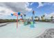 Community splash pad featuring interactive water features and slides for children at 4820 Coastal Days Ln, Bradenton, FL 34211