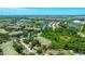 An aerial perspective reveals a thriving community nestled amid lush greenery and tranquil lakes at 5160 Northridge Rd # 206, Sarasota, FL 34238