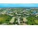 A scenic aerial view showcases the neighborhood with its lush greenery and serene lakes at 5160 Northridge Rd # 206, Sarasota, FL 34238