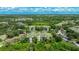 An aerial view reveals the lush, tree-lined community and complex at 5160 Northridge Rd # 206, Sarasota, FL 34238