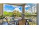 Relaxing screened balcony with comfortable seating to enjoy pleasant outdoor views at 5160 Northridge Rd # 206, Sarasota, FL 34238