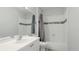 Bright bathroom features a shower-tub combination with decorative tile accents at 5160 Northridge Rd # 206, Sarasota, FL 34238