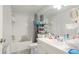 Clean bathroom featuring a shower-tub combo, white vanity, and ample storage at 5160 Northridge Rd # 206, Sarasota, FL 34238