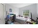 Bedroom that includes a desk, bed, and window with natural light at 5160 Northridge Rd # 206, Sarasota, FL 34238