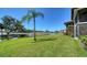 Beautiful backyard with a pond and golf course views from the edge of the property at 5630 Golf Pointe Dr # 205, Sarasota, FL 34243