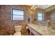 Stylish bathroom showcasing custom tile work, granite vanity, and decorative lighting at 5630 Golf Pointe Dr # 205, Sarasota, FL 34243