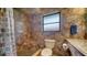 Beautiful bathroom featuring custom tile work, glass shower, and granite countertop vanity at 5630 Golf Pointe Dr # 205, Sarasota, FL 34243