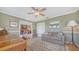 Cozy living area featuring a ceiling fan and access to other rooms at 5630 Golf Pointe Dr # 205, Sarasota, FL 34243