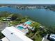 Breathtaking aerial view of community with lake, pools, spa, and well-maintained grounds at 5910 Majestic Way, Palmetto, FL 34221