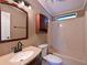 Clean bathroom featuring a single vanity, toilet, and shower-tub combo at 5910 Majestic Way, Palmetto, FL 34221