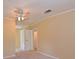 Bedroom with light-colored walls, ceiling fan and closet at 5910 Majestic Way, Palmetto, FL 34221