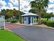 Community entrance with gatehouse and landscaped areas in Imperial Lakes neighborhood at 5910 Majestic Way, Palmetto, FL 34221