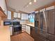Well-equipped kitchen featuring stainless steel appliances and stylish white cabinets at 5910 Majestic Way, Palmetto, FL 34221