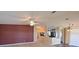 Spacious living area with ample lighting and a view into the kitchen and additional rooms at 5910 Majestic Way, Palmetto, FL 34221