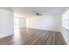 Bright, spacious living room featuring modern wood flooring and ample natural light at 6235 Carlton Ave, Sarasota, FL 34231