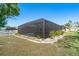 Outdoor entertainment area features covered spa surrounded by lush garden at 6387 Shalimar St, Port Charlotte, FL 33981