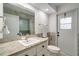 Bathroom featuring tiled shower, vanity sink and toilet at 6387 Shalimar St, Port Charlotte, FL 33981