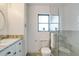 Bathroom featuring tiled shower, vanity sink and toilet at 6387 Shalimar St, Port Charlotte, FL 33981