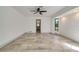 Large bedroom with neutral paint colors and tile floors, leading to an ensuite at 6387 Shalimar St, Port Charlotte, FL 33981