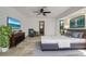 Spacious bedroom with a large bed, tile flooring, and an ensuite bathroom at 6387 Shalimar St, Port Charlotte, FL 33981