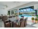 Inviting covered patio with dining set, offering seamless indoor-outdoor living at 6387 Shalimar St, Port Charlotte, FL 33981