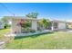 Lovely single-story home with stone accents, mature landscaping, and a well-kept lawn at 6387 Shalimar St, Port Charlotte, FL 33981