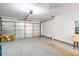 Interior view of a spacious two-car garage featuring ample storage and utility sink at 6387 Shalimar St, Port Charlotte, FL 33981