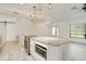 Well-appointed kitchen with stainless steel appliances, a center island, and modern lighting fixtures at 6387 Shalimar St, Port Charlotte, FL 33981