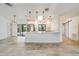 Modern kitchen with white cabinets, stainless steel appliances, and a stylish island with seating at 6387 Shalimar St, Port Charlotte, FL 33981