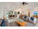 Open-concept living space with dining area, modern kitchen, and large sliding doors leading to the outdoors at 6387 Shalimar St, Port Charlotte, FL 33981