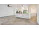 Open-concept living room and kitchen featuring tile floors, bright lighting, and lots of space at 6387 Shalimar St, Port Charlotte, FL 33981