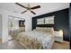 Bright bedroom featuring a ceiling fan, neutral tile floors, and a mirrored closet at 6660 Schooner Bay Cir # 6660, Sarasota, FL 34231