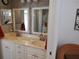 Bright bathroom featuring a dual sink vanity with white cabinetry at 6821 Fairview Ter # 6821, Bradenton, FL 34203