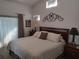 Bright bedroom featuring a queen-size bed, high ceilings, and neutral decor at 6821 Fairview Ter # 6821, Bradenton, FL 34203