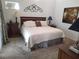 Comfortable bedroom featuring a queen-size bed, neutral decor, and natural light at 6821 Fairview Ter # 6821, Bradenton, FL 34203